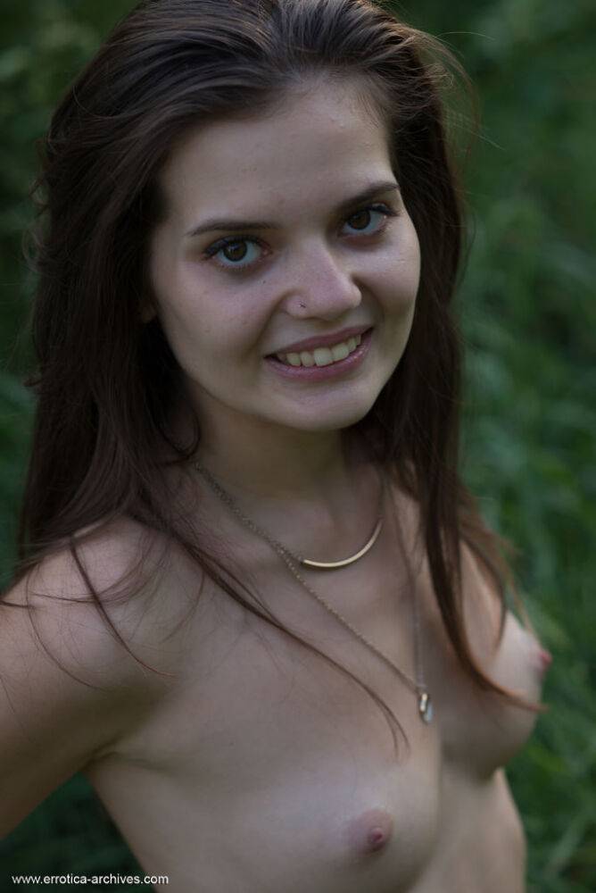 Petite young girl Pola gets naked in footwear on a bank while out in nature - #15