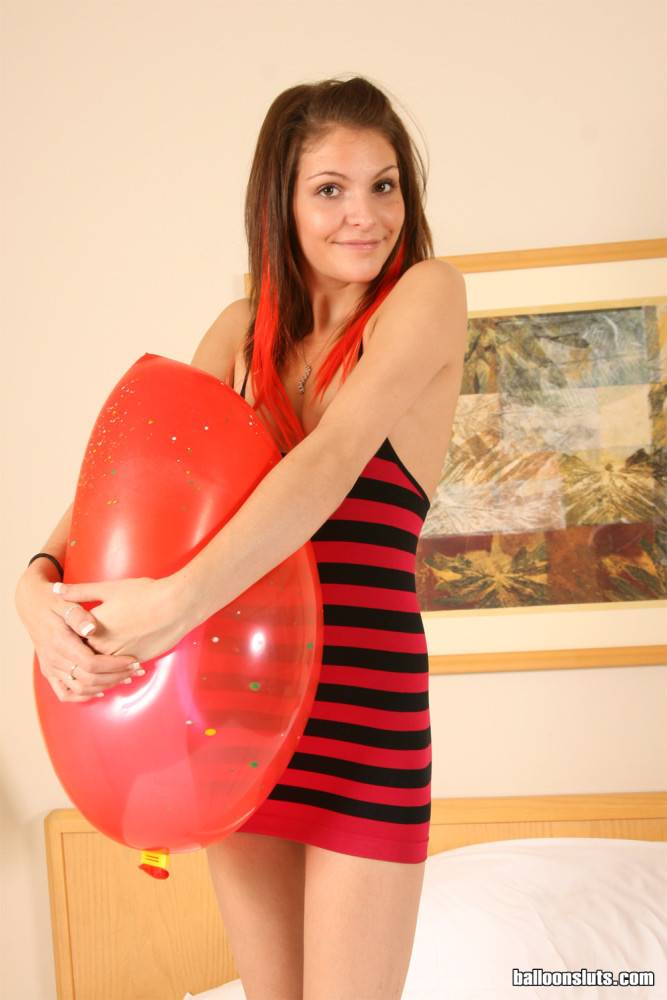 Skinny teen girl that loves balloons bouncing on a big one until it pops - #4