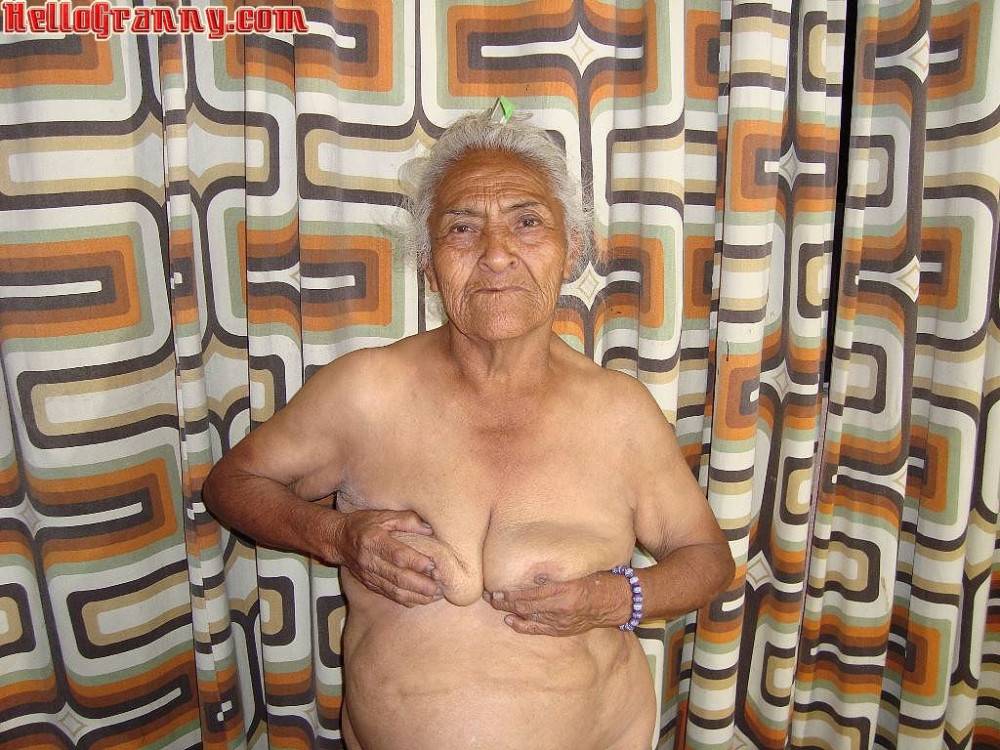 Granny in chair shows her pussy and big tits - #8