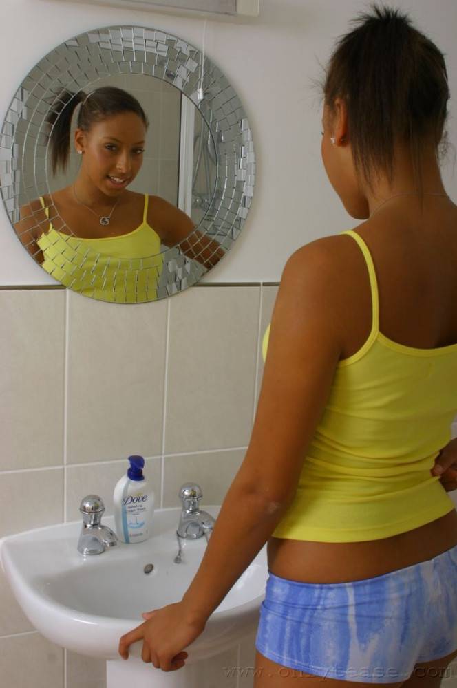 Ponytailed Ebony Teen Amy-Lou Displays Her Shapely Tits While Stripping In The Bathroom - #1