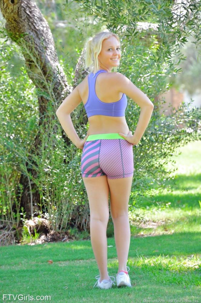 Stunning blonde youthful Megan in sexy shorts exposes tiny tits and loves dildo outdoor - #1