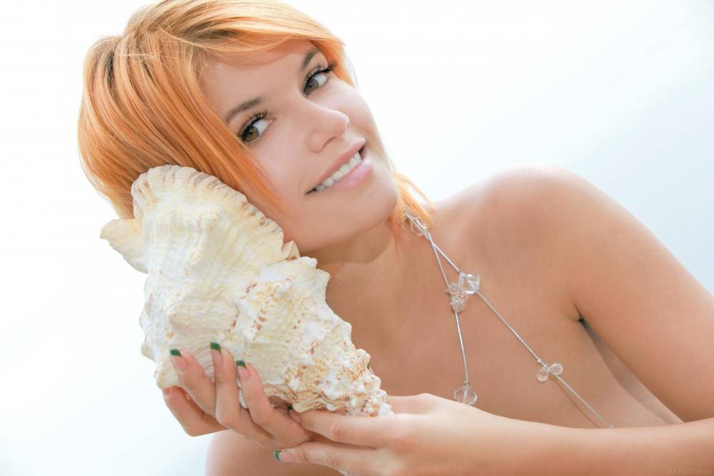 Busty Redhead Violla A Listens To A Sea Shell While Giving A Full View Of Her Shaved Snatch. - #2