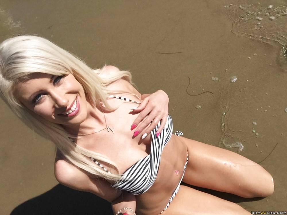 Alluring american blonde Riley Jenner in bikini shows big tits and spreads her legs on the beach - #5