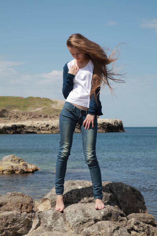 Gracile blonde teen Milena D in jeans exhibits small tits and butt on the beach - #2