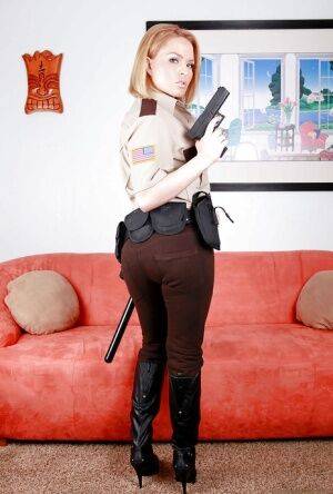 Hot babe in police uniform Krissy Lynn stripping and spreading her legs on nudepicso.com