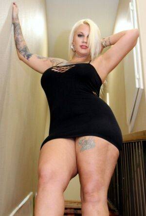 Fat blonde with tattoos Lucky B Dallas gets banged on staircase on nudepicso.com