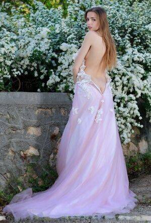 Beautiful girl Elle Tan slips off wedding dress to pose nude in garden on nudepicso.com