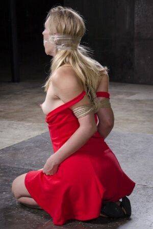 Blonde female Mona Wales has her first Shibari experience in a dungeon on nudepicso.com