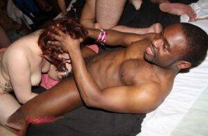 Amateur individuals take part in an interracial group sex scene on nudepicso.com