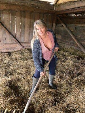 Overweight amateur Sweet Susi strips naked while forking hay in a mow on nudepicso.com