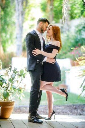 Pale redhead Ella Hughes seduces her man in a short black dress and heels on nudepicso.com