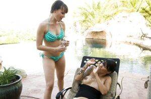 Hot lesbians Dana DeArmond & Dana Vespoli have some strapon fun outdoor on nudepicso.com