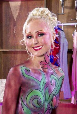 Hot older blonde Natasha Voya rocks it out wearing body paint only on nudepicso.com