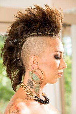 Solo model Bella Bellz flaunts her tattooed ass with hair in a mohawk cut on nudepicso.com