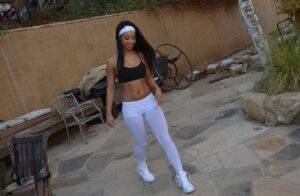 Flexible amateur Latina cutie Teanna Trump works out in yoga pants outdoors on nudepicso.com