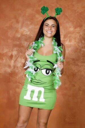 Amateur Kaley Kade flashes while wearing a green M&M dress on St Patty's Day on nudepicso.com