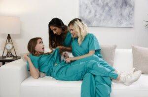 Teen lesbians remove scrubs and socks before an all girl threesome on nudepicso.com