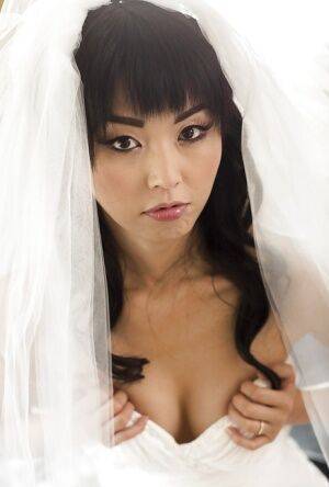Hot Asian pornstar Marica Hase posing topless in wedding dress on nudepicso.com