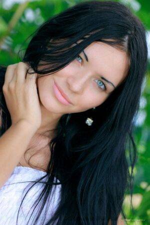 Dark haired Russian teen Kitti A strips totally naked under a tree - Russia on nudepicso.com