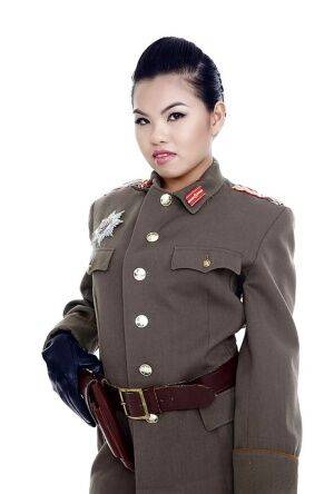 Oriental pornstar Cindy Starfall posing solo in military garb on nudepicso.com