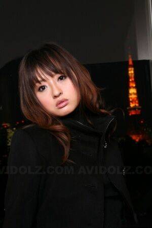 Japanese girl with a pretty face models non nude in a black coat and jeans - Japan on nudepicso.com