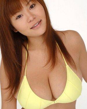 Pretty Japanese redhead Yoko Matsugane models a yellow bikini in bare feet - Japan on nudepicso.com