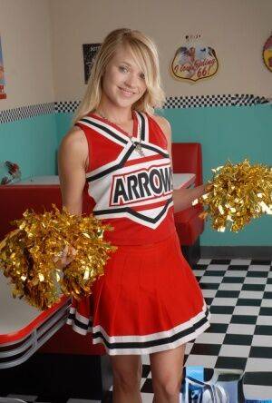 Cute blonde Tegan Summers models non nude in her cheerleader uniform on nudepicso.com