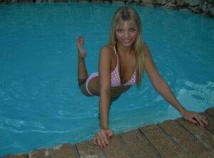 Blonde amateur Jana Jordan models a bikini while in an indoor swimming pool - Jordan on nudepicso.com