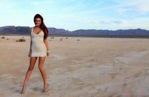 Hot solo model Jayden Cole smokes a cigarette while flashing in the desert on nudepicso.com