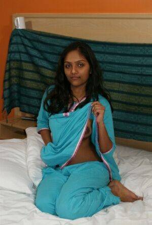 Hot Indian slut Divya removes her shirt to show her big dark nipples - India on nudepicso.com