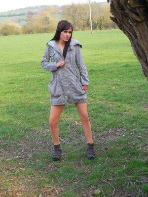 First timer Aglaia Augury gets naked by a tree with her boots on on nudepicso.com