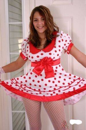 Cute teen Kara exposes white underwear in fishnets and a polka-dot dress on nudepicso.com