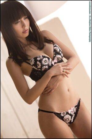 Beautiful Asian model Marica Hase strikes great poses while removing lingerie on nudepicso.com