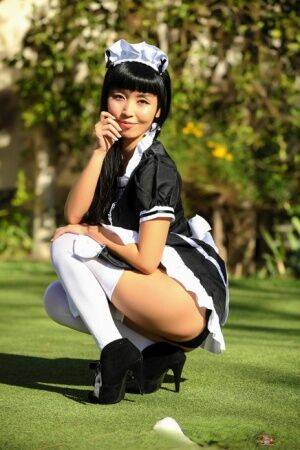 Japanese maid Marica Hase exposes her tits and twat on a putting green - Japan on nudepicso.com