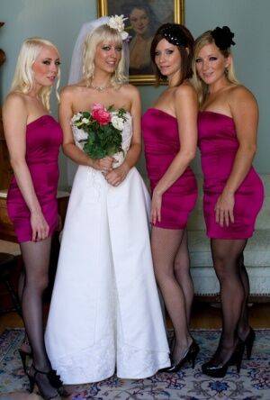 Blonde bride is forced to submit to dominant lesbians in a dungeon on nudepicso.com