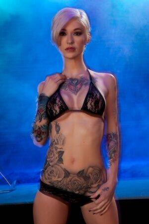 Hot tattooed Kleio Valentien sheds black lace panties to squat & spread legs on nudepicso.com