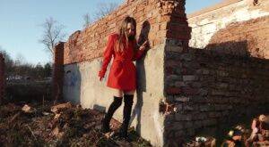 Caucasian girl Nastya takes a piss behind the remnants of a brick house on nudepicso.com
