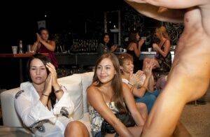 Splendid girls have fun with a dancing bear on a wild clothed party on nudepicso.com