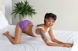 Tattooed Asian girl Saya Song has POV sex with a big white cock on nudepicso.com