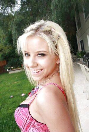 Tiny blonde teen Tessa Taylor revealing nice tits and tit ass on lawn on nudepicso.com