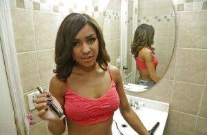 Amateur black babe Nicole flaunting big natural saggy tits in bathroom on nudepicso.com