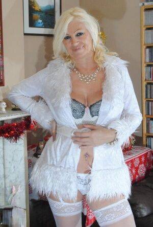 Older amateur Platinum Blonde shows her floppy tits in white panties & hosiery on nudepicso.com