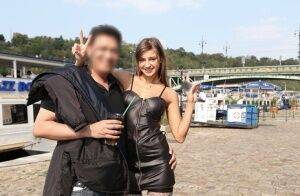 Skinny teen Maria in black leather dress strips naked at a public venue on nudepicso.com