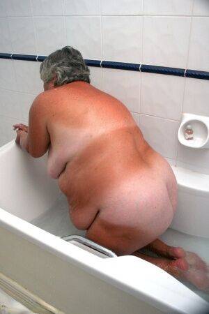 Obese old woman Grandma Libby gets completely naked while having a bath on nudepicso.com