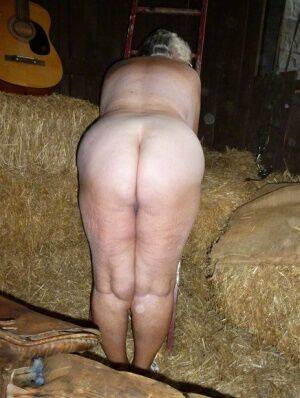 Fat oma Grandma Libby gets naked in a barn while playing acoustic guitar on nudepicso.com