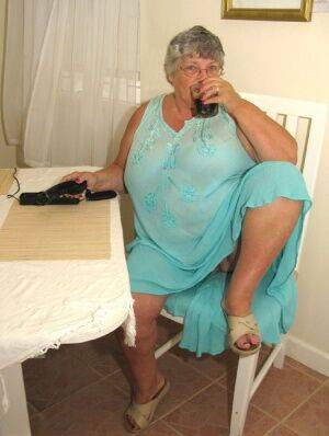 Obese amateur Grandma Libby bares her tan lined body after a phone sex on nudepicso.com