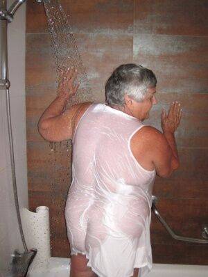 Obese amateur Grandma Libby blow drys her hair after taking a shower on nudepicso.com