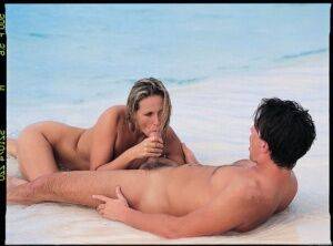 Hot blond chicks gets banged hard on the white sand of a tropical island beach on nudepicso.com