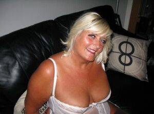 Overweight blonde Chrissy Uk exposes herself in white lingerie and nylons on nudepicso.com