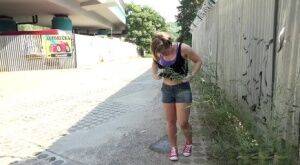 White girl pulls down her panties before squatting for a piss on country road on nudepicso.com